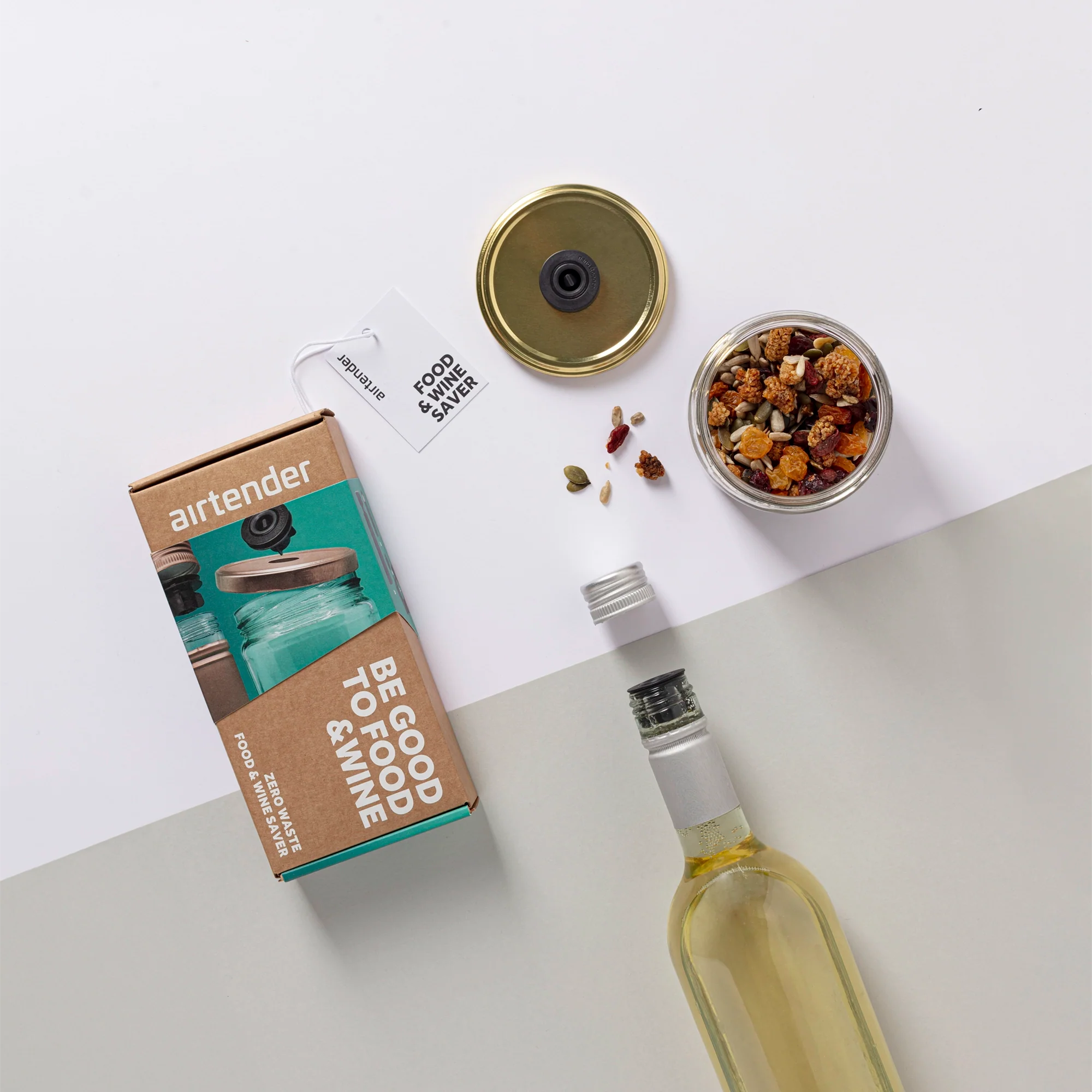 Airtender Extra Stoppers Gift Box packaging with a jar mixed nuts and a vacuum sealed wine bottle on a light background